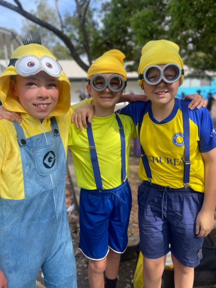 three-students-dressed-in-minion-outfits