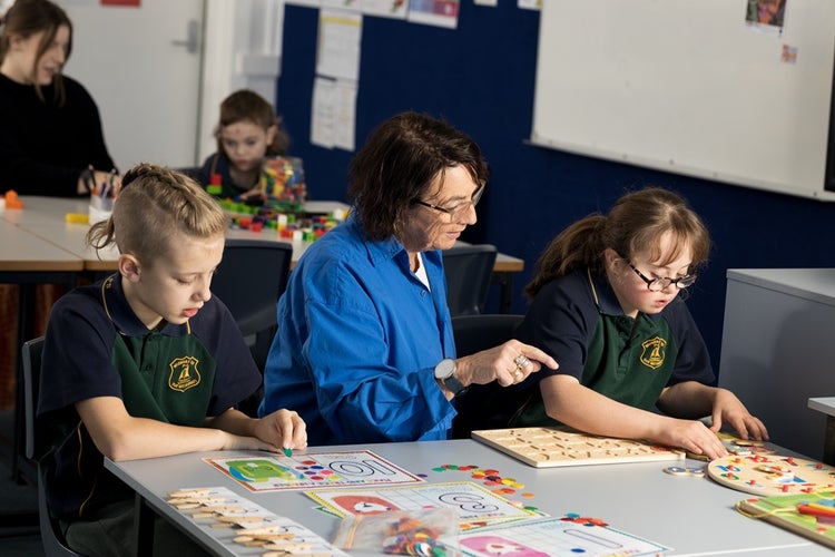 mrs-bird-helping-two-students